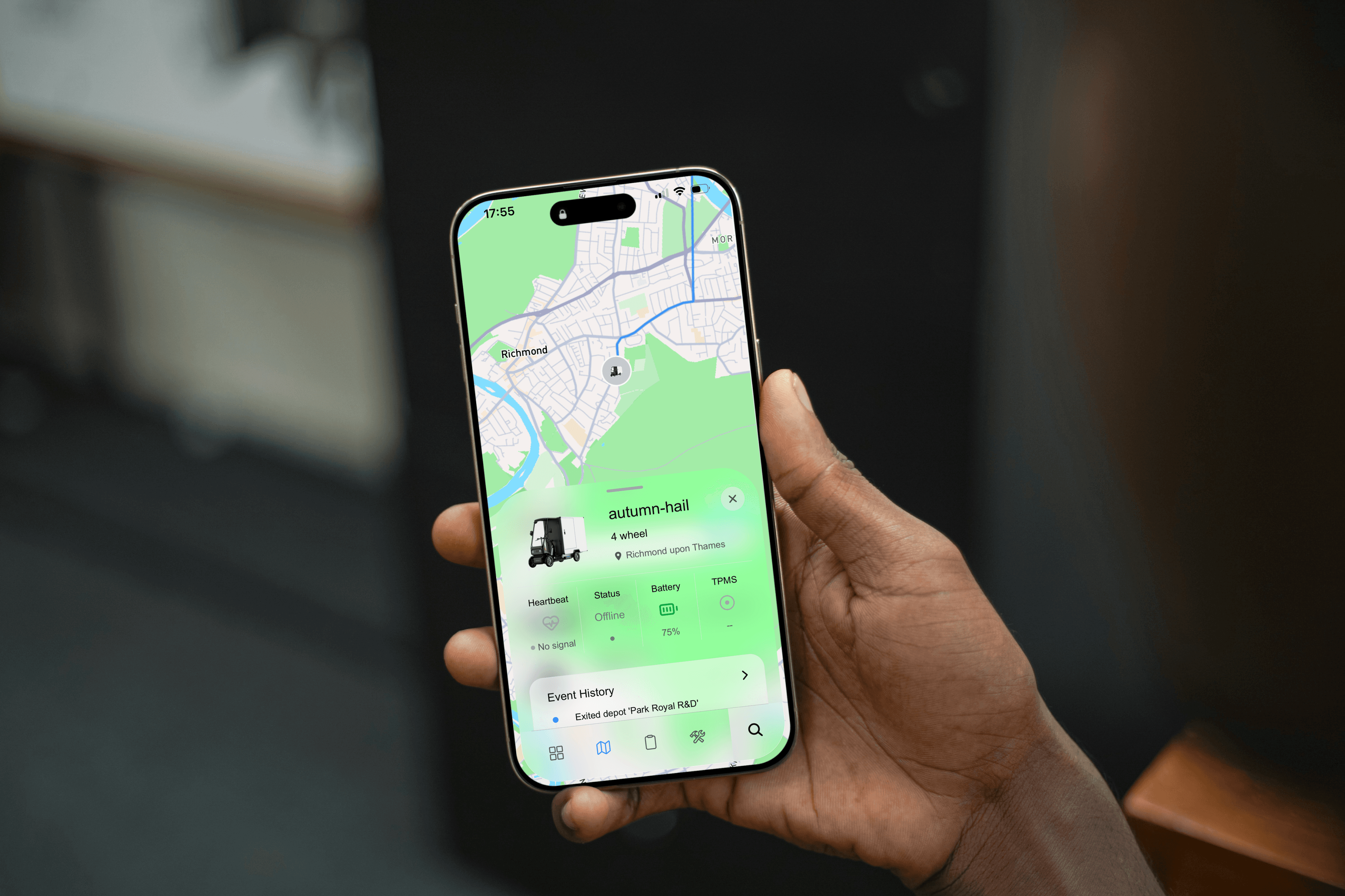 The FleetOS fleet-management app running on a phone